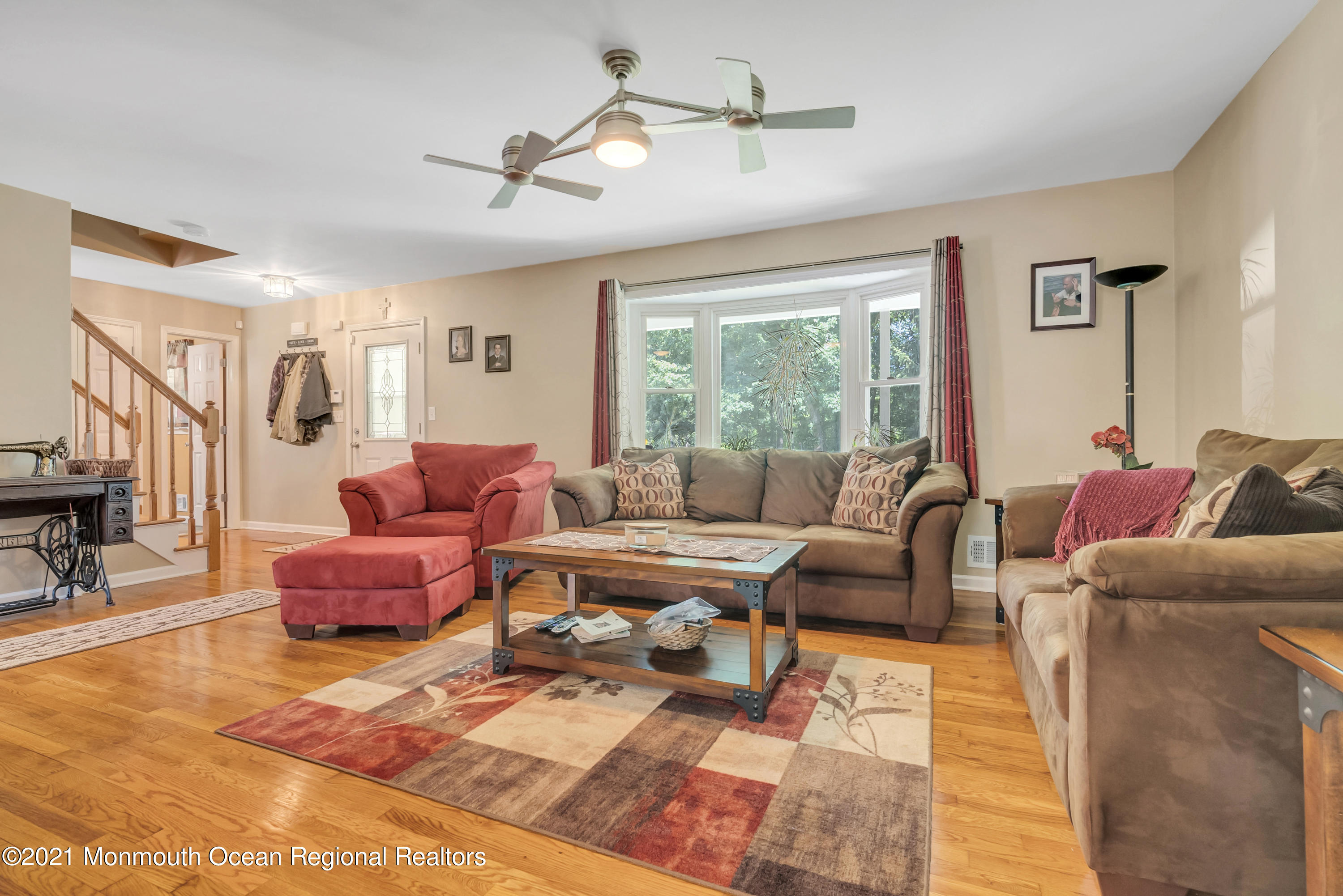 93 Jackson Mills Road Jackson, NJ 08527 - Photo 8 of 39 a living room with furniture ceiling fan and a rug