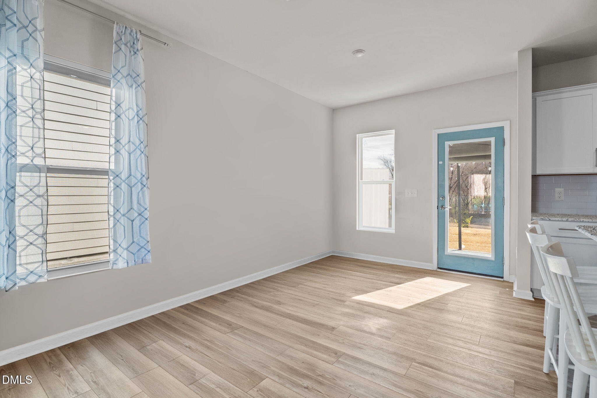 1572 Rhodes Pond Street Wendell, NC 27591 - Photo 11 of 44 a view of a room with wooden floor and a window