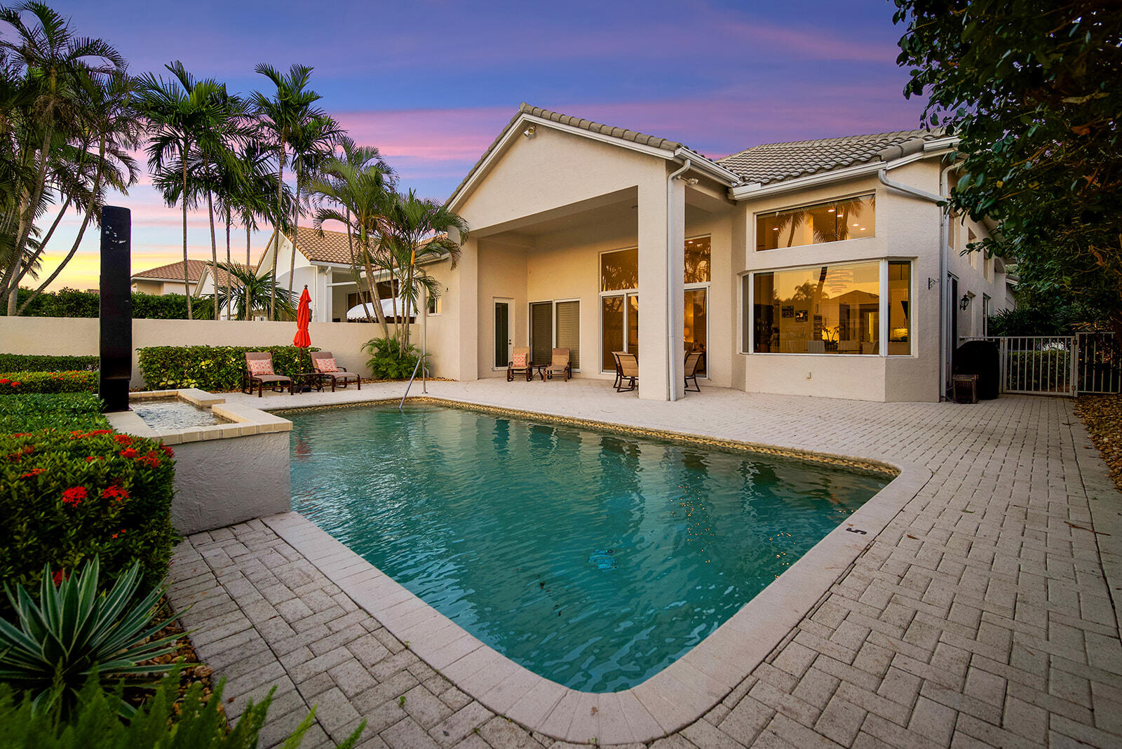 17051 Grand Bay Drive Boca Raton, FL 33496 - Photo 13 of 91 a view of a swimming pool with chairs