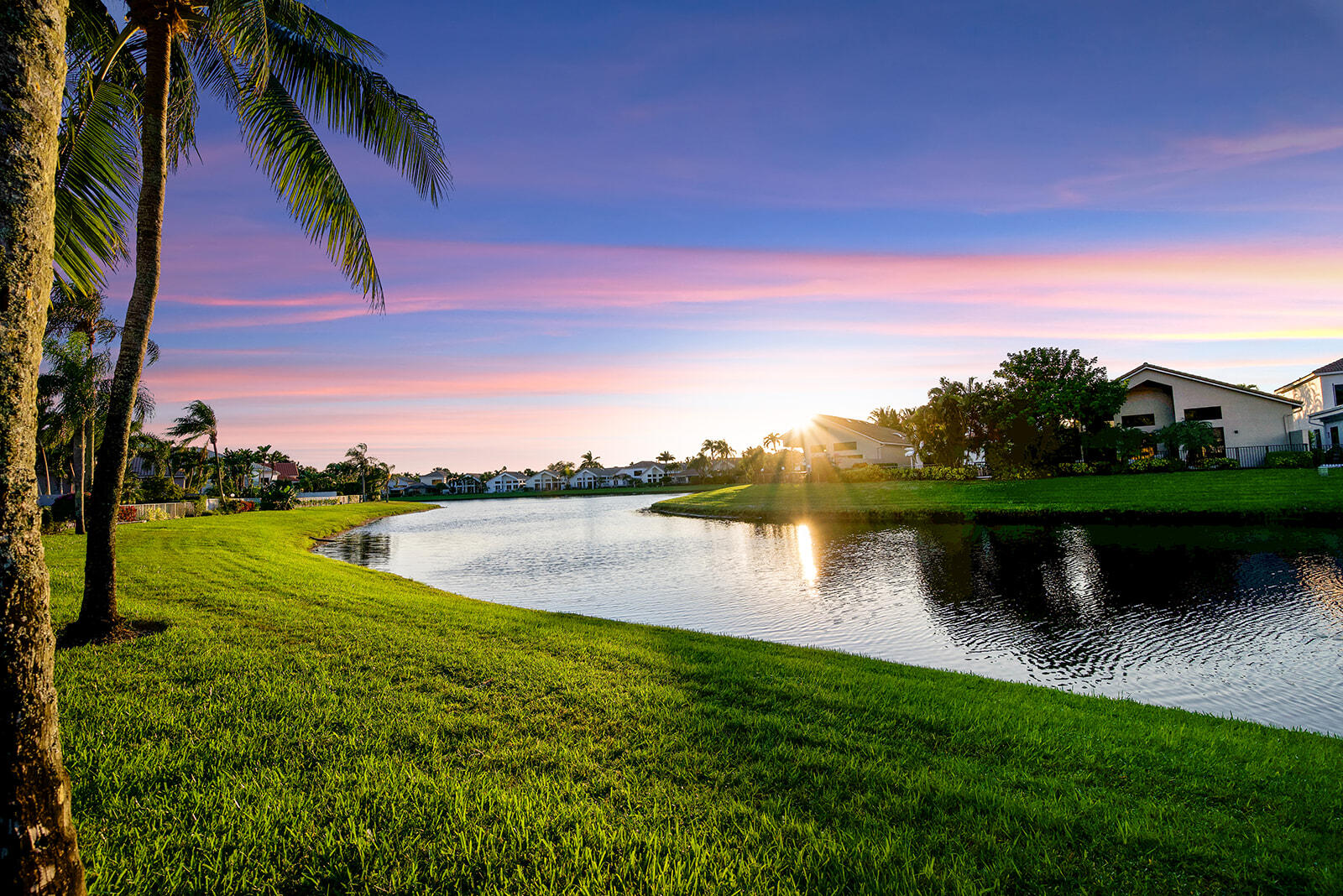 17051 Grand Bay Drive Boca Raton, FL 33496 - Photo 14 of 91 a view of a lake with houses in the back