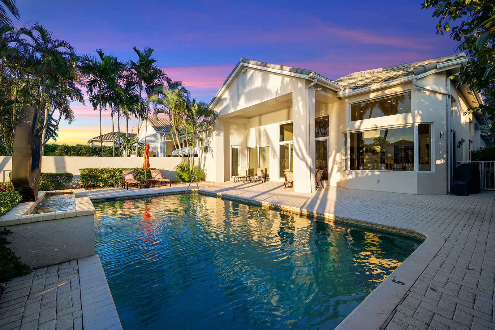 17051 Grand Bay Drive Boca Raton, FL 33496 - Photo 19 of 91 a view of a house with swimming pool and sitting area
