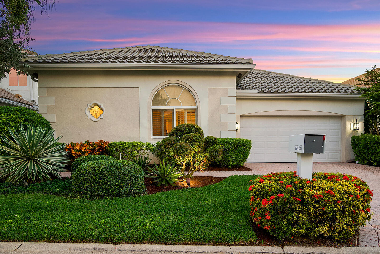 17051 Grand Bay Drive Boca Raton, FL 33496 - Photo 2 of 91 a front view of a house with garden