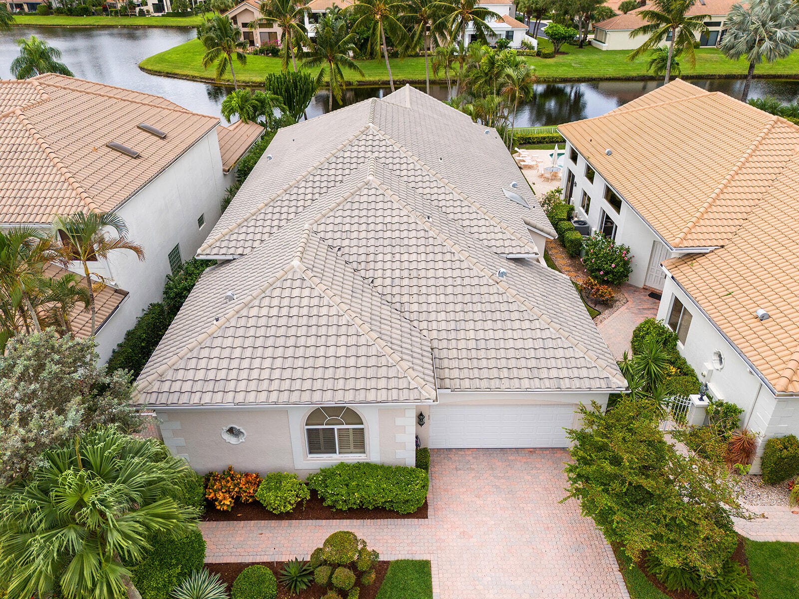 17051 Grand Bay Drive Boca Raton, FL 33496 - Photo 41 of 91 a view of a white house with a yard and plants
