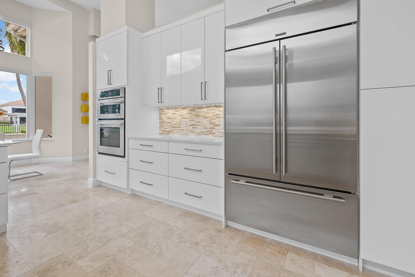 17051 Grand Bay Drive Boca Raton, FL 33496 - Photo 47 of 91 a kitchen with white cabinets and refrigerator