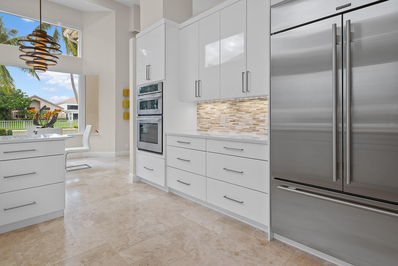 17051 Grand Bay Drive Boca Raton, FL 33496 - Photo 49 of 91 a kitchen with white cabinets and refrigerator
