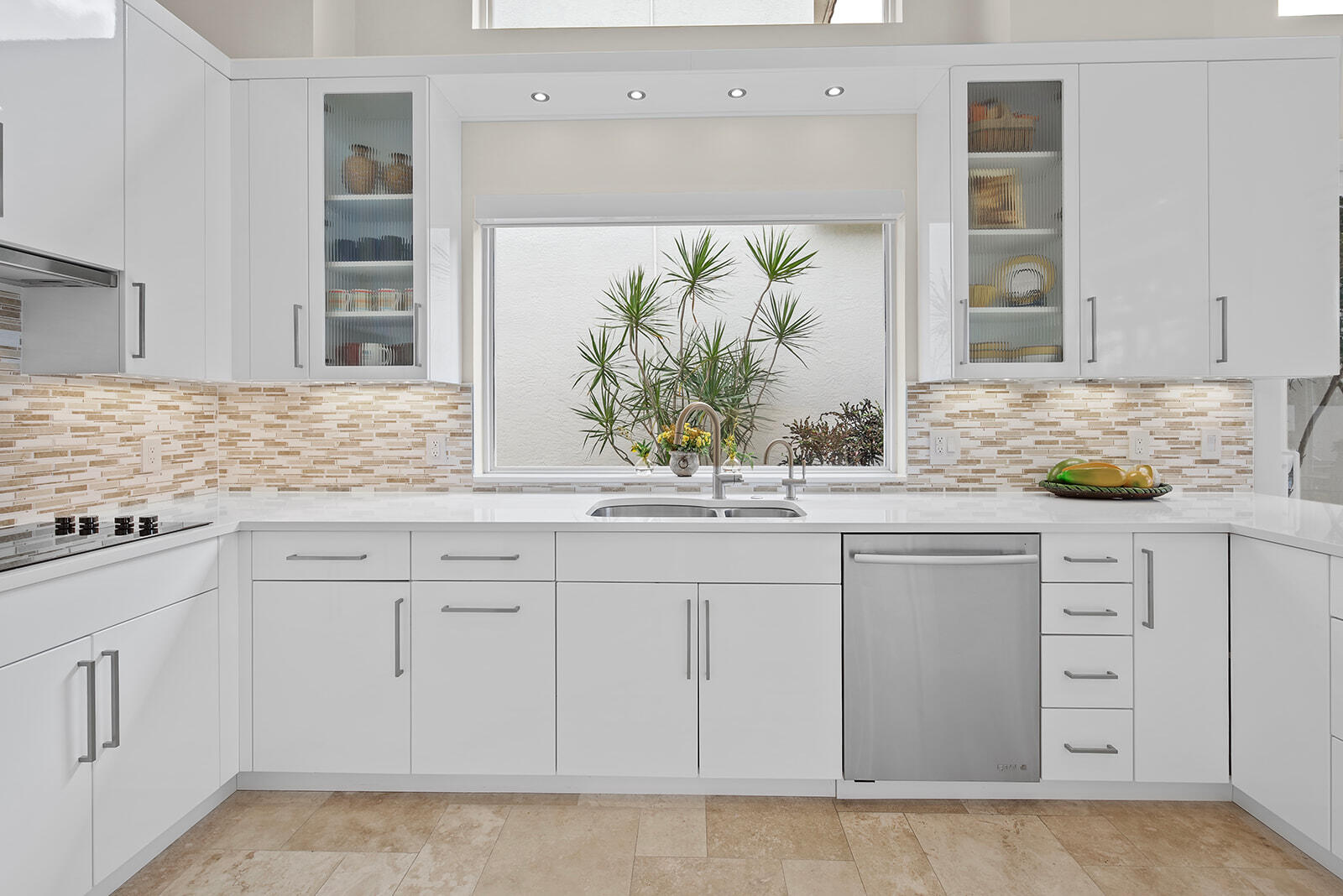 17051 Grand Bay Drive Boca Raton, FL 33496 - Photo 54 of 91 a kitchen with white cabinets and a window