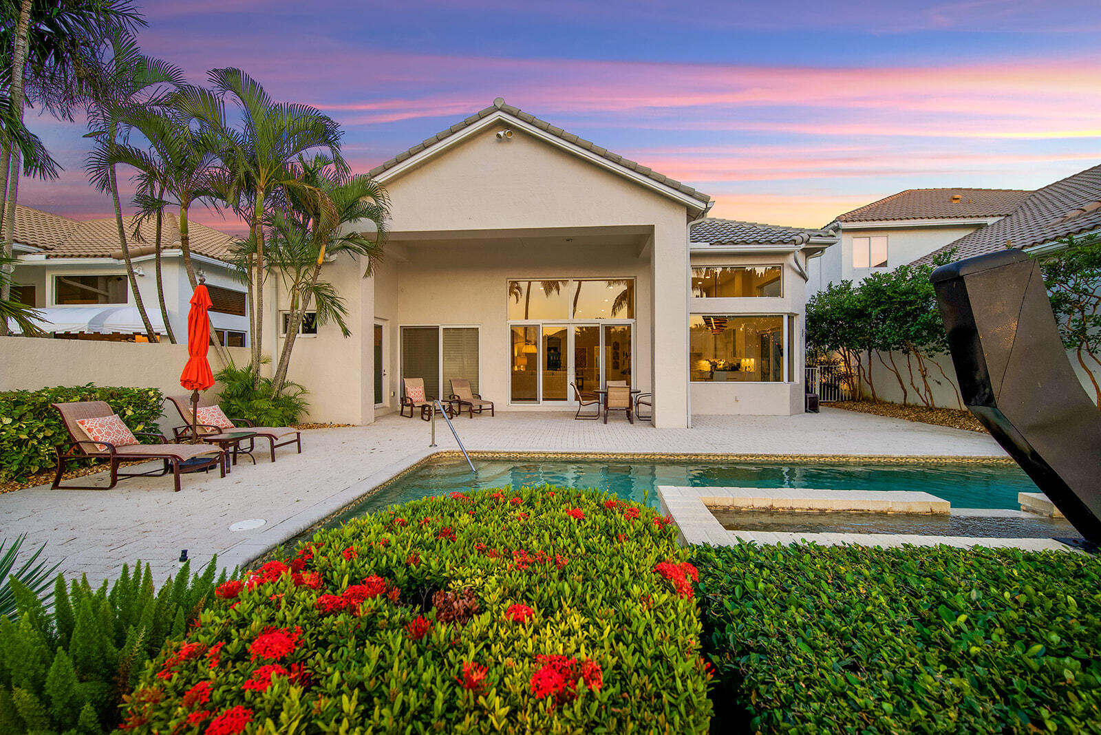 17051 Grand Bay Drive Boca Raton, FL 33496 - Photo 6 of 91 a view of a house with swimming pool and sitting area