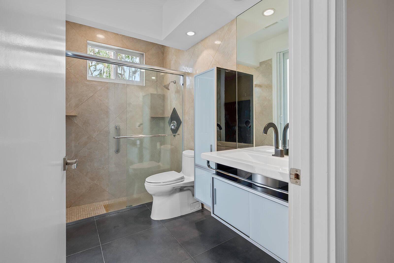 17051 Grand Bay Drive Boca Raton, FL 33496 - Photo 64 of 91 a bathroom with a granite countertop toilet a sink and a shower