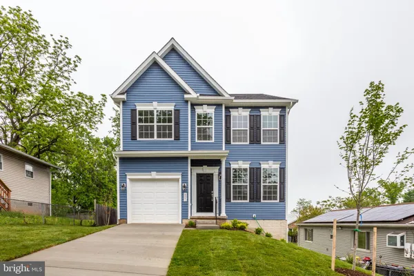 front view of a house with a yard