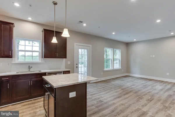 a stove top oven sitting inside of a kitchen
