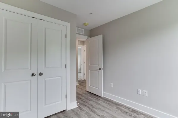 a bathroom with a granite countertop sink mirror toilet and bathtub