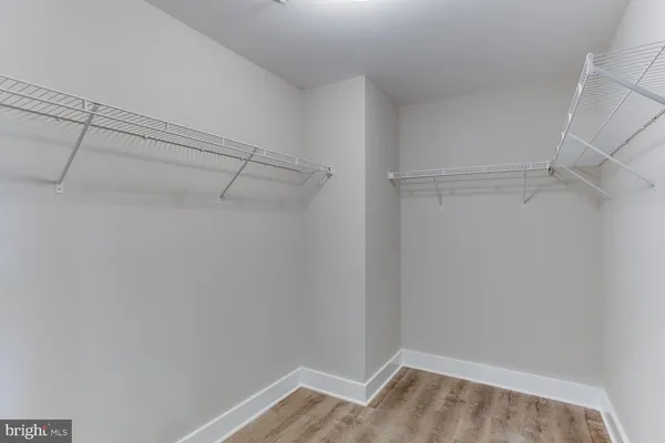 a bathroom with a sink toilet and a mirror