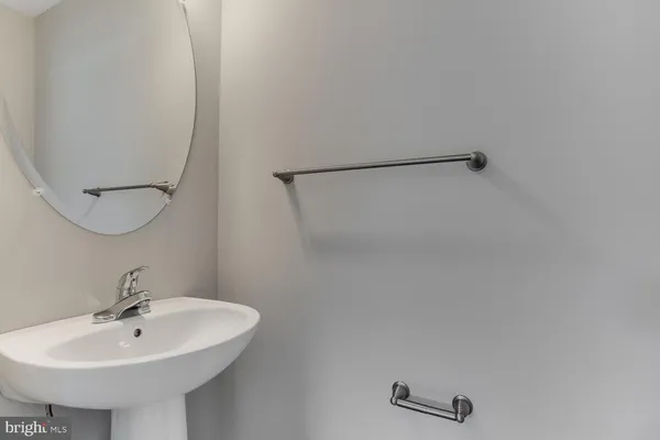 a large kitchen with a large counter top stainless steel appliances and window