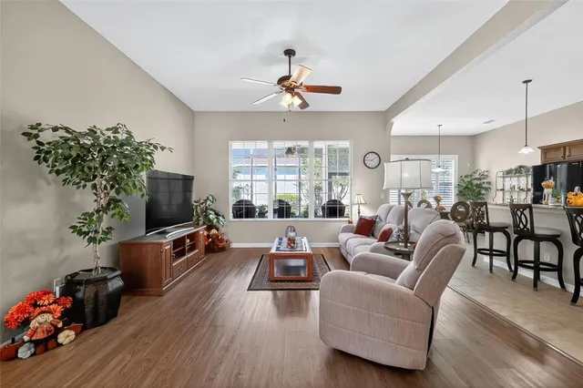 a living room with furniture fireplace and flat screen tv
