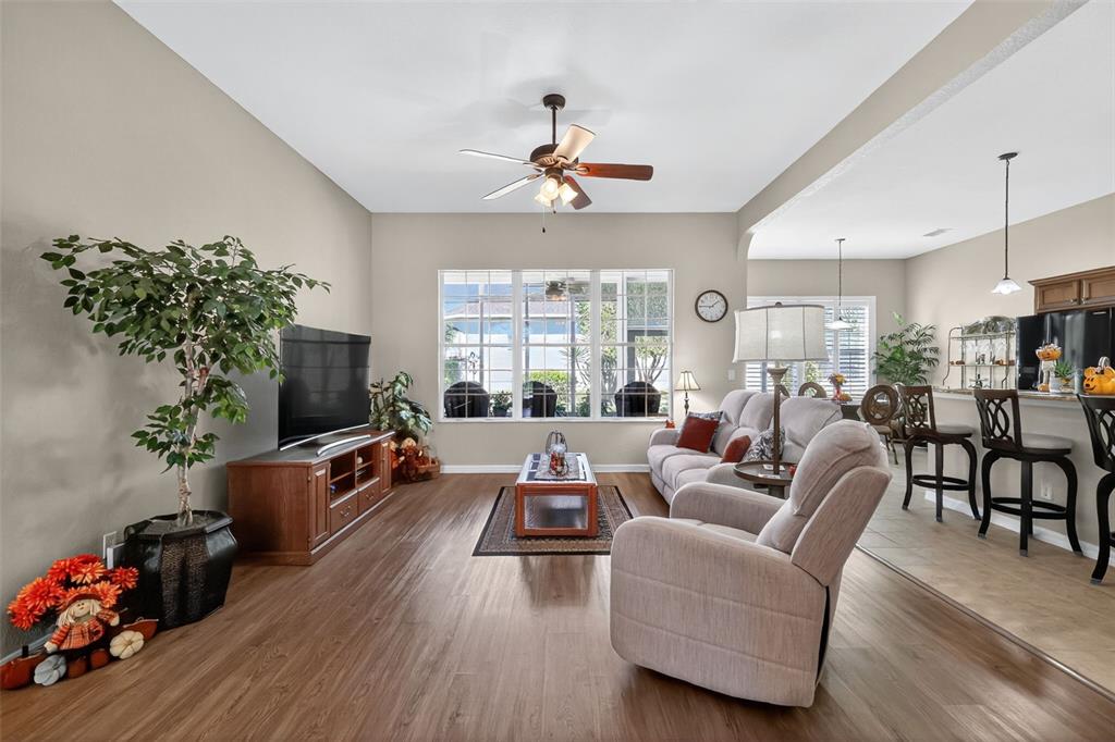 12103 Southeast 176th Loop Summerfield, FL 34491 - Photo 12 of 25 a living room with furniture fireplace and flat screen tv
