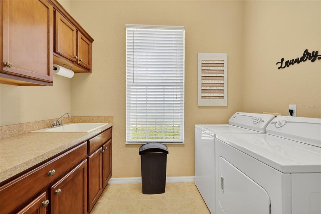 12103 Southeast 176th Loop Summerfield, FL 34491 - Photo 23 of 25 a utility room with dryer and washer