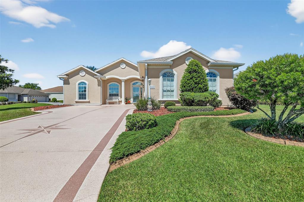 12103 Southeast 176th Loop Summerfield, FL 34491 - Photo 3 of 25 a view of a house with a big yard plants and large trees