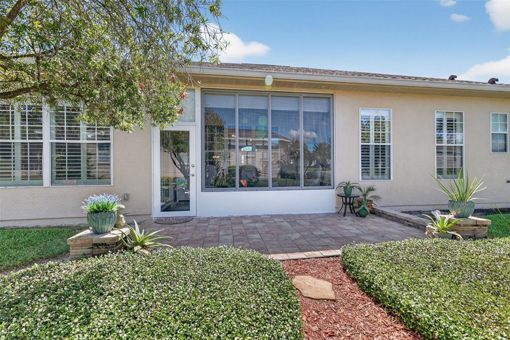 12103 Southeast 176th Loop Summerfield, FL 34491 - Photo 9 of 25 a front view of a house with garden