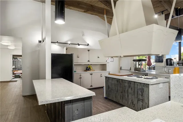 a kitchen with a sink a stove and refrigerator
