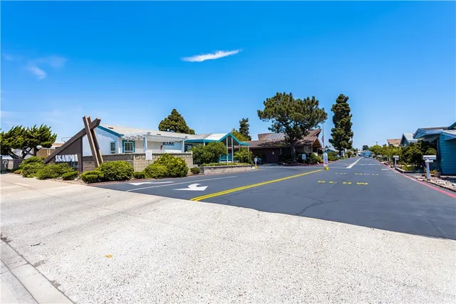 a front view of a house with a yard and a garage