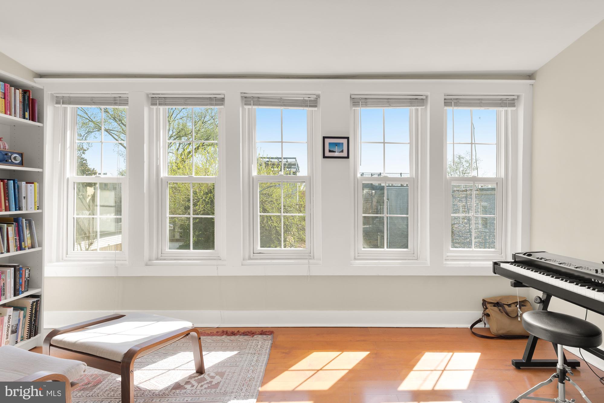 1109 7th Street Northeast Washington, DC 20002 - Photo 17 of 32 a living room with furniture and a window