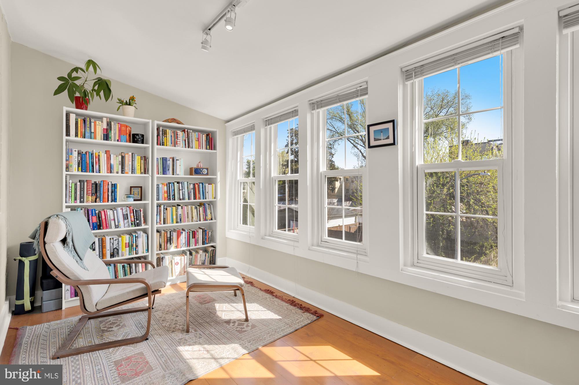 1109 7th Street Northeast Washington, DC 20002 - Photo 18 of 32 a living room with furniture book shelf and a window