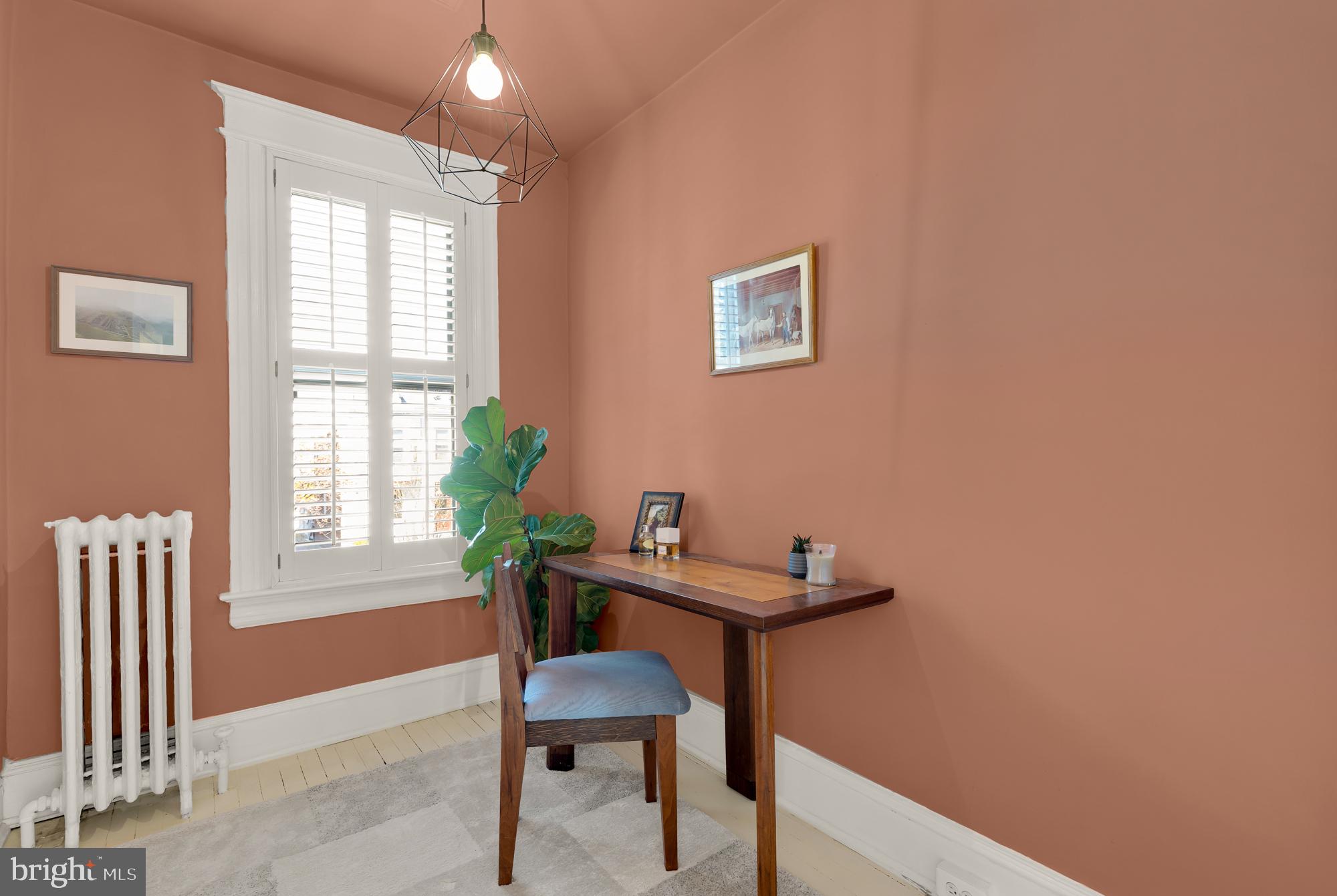1109 7th Street Northeast Washington, DC 20002 - Photo 21 of 32 a view of a workspace with furniture and a window