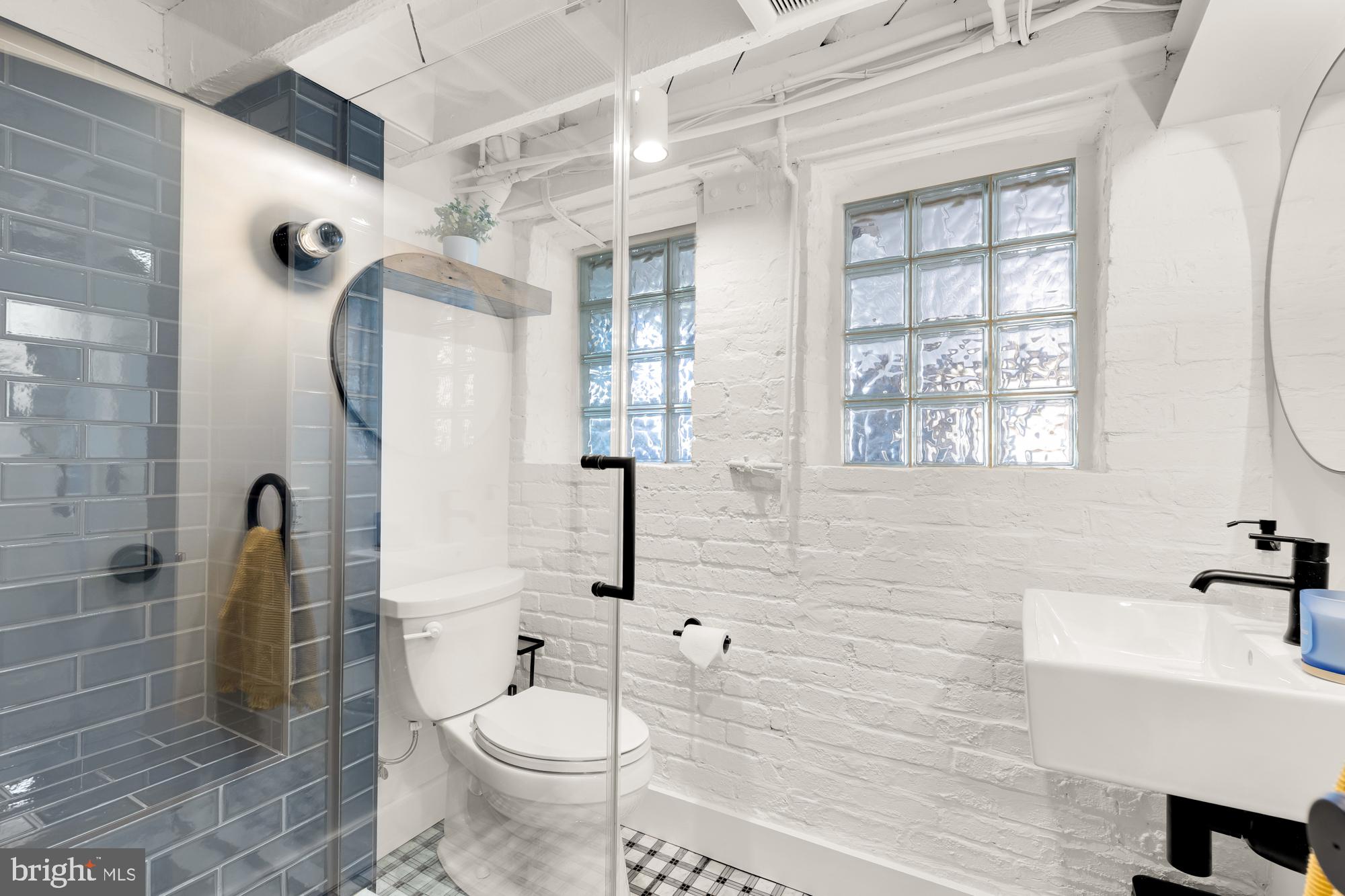 1109 7th Street Northeast Washington, DC 20002 - Photo 26 of 32 a bathroom with a sink toilet and shower