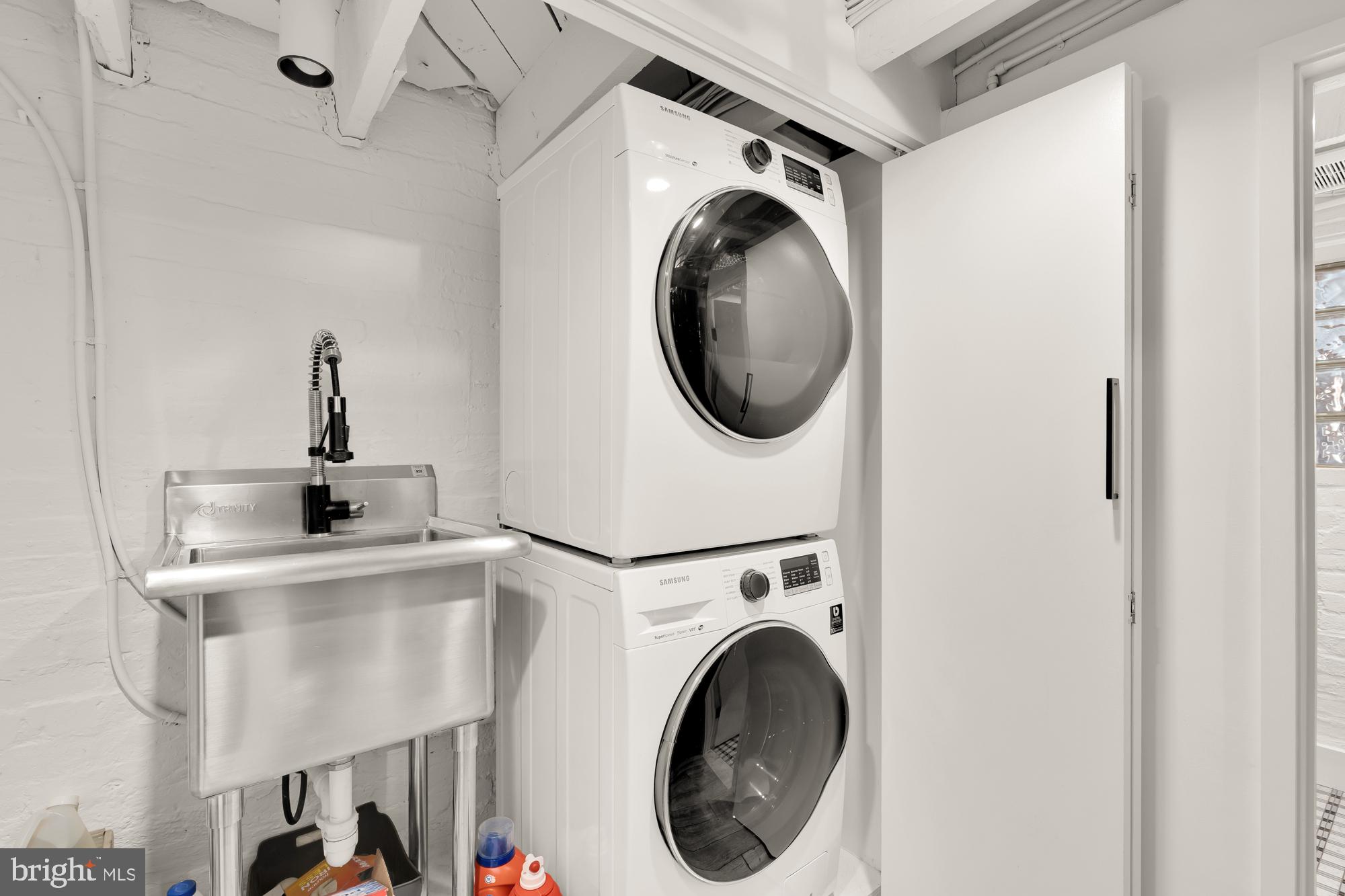1109 7th Street Northeast Washington, DC 20002 - Photo 28 of 32 a view of a hallway with washer and dryer