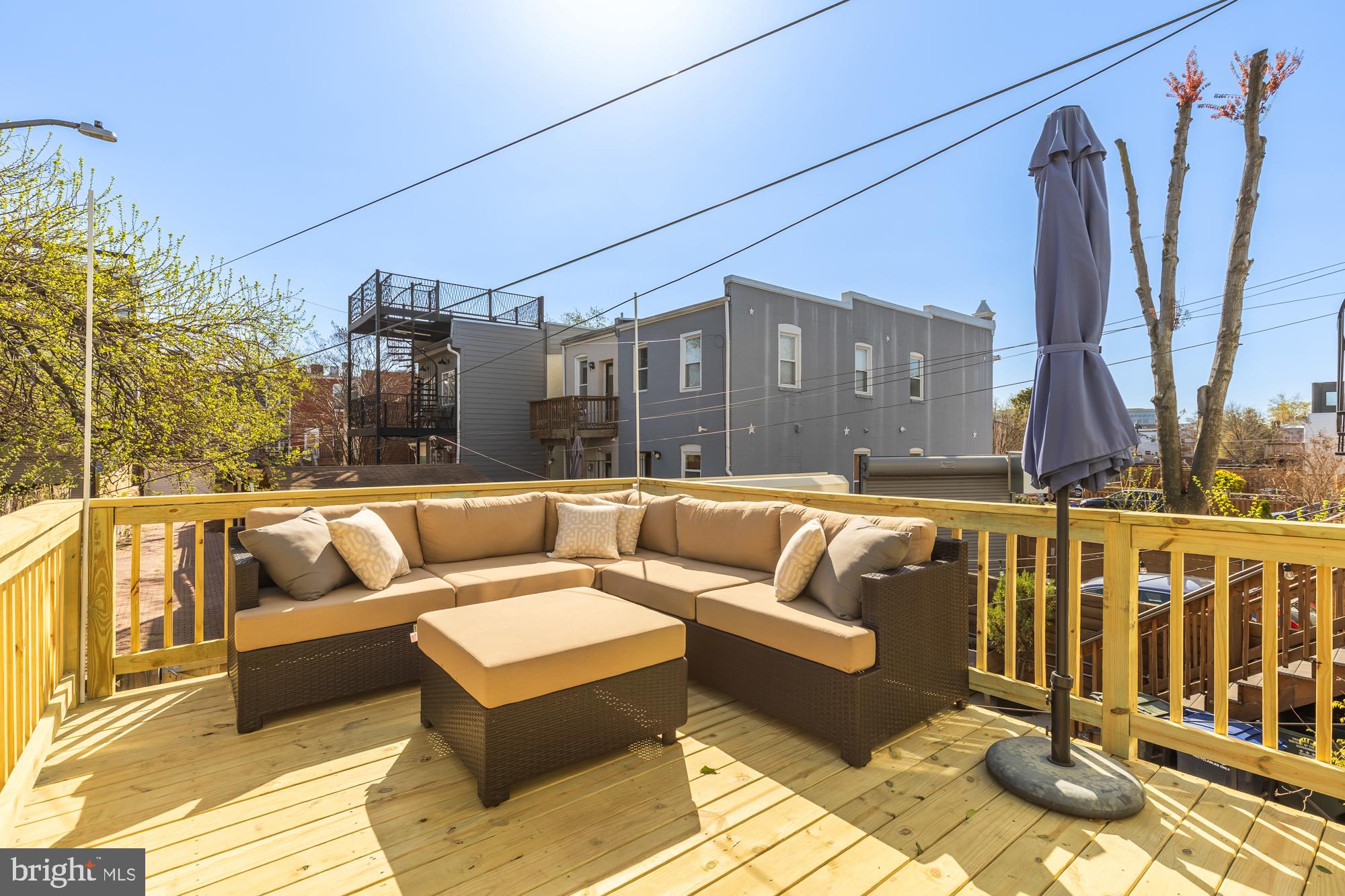 1109 7th Street Northeast Washington, DC 20002 - Photo 29 of 32 a view of a roof deck with couches and potted plants