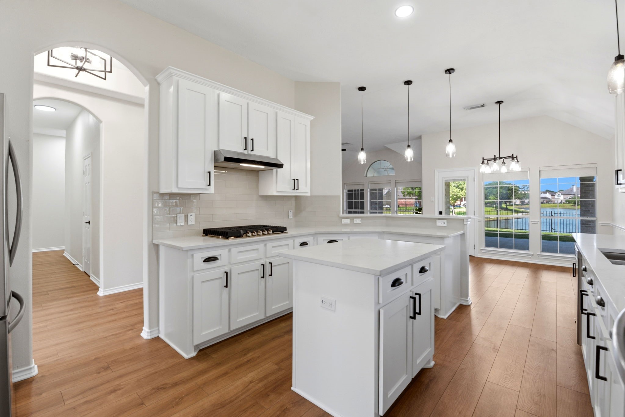 29819 South Legends Village Circle Spring, TX 77386 - Photo 17 of 48 a kitchen with stainless steel appliances sink stove and wooden floor
