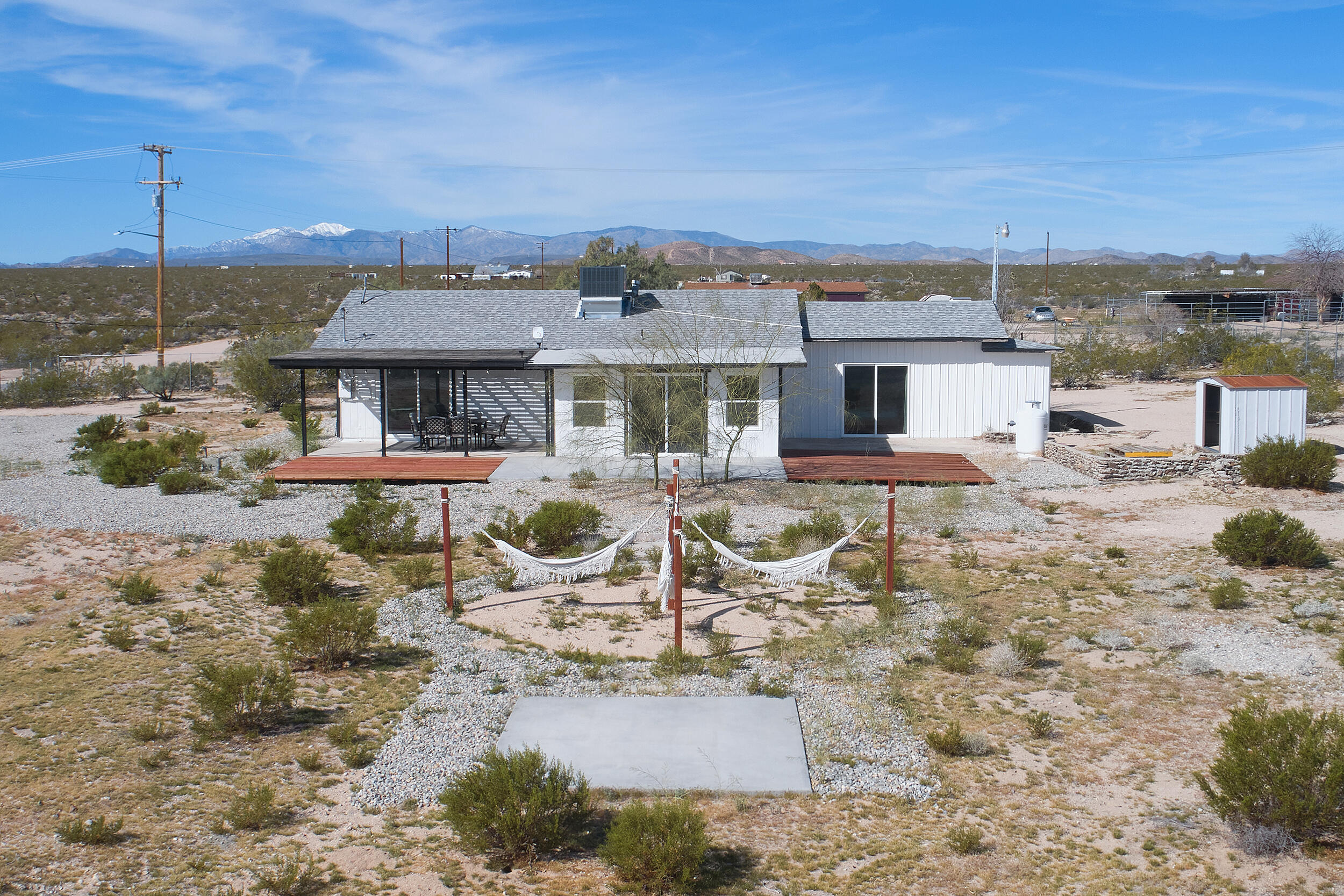 2071 Border Avenue Joshua Tree, CA 92252 - Photo 1 of 50 a view of a patio with a table and chairs