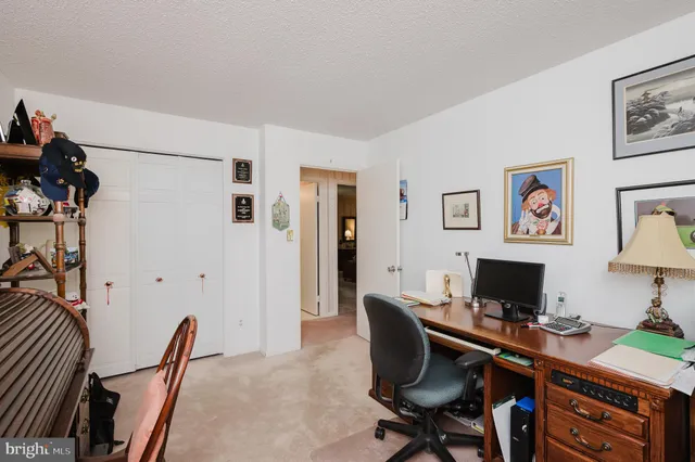 a view of a workspace with furniture