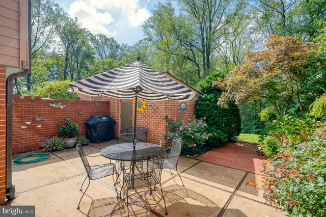 a front view of house with a garden