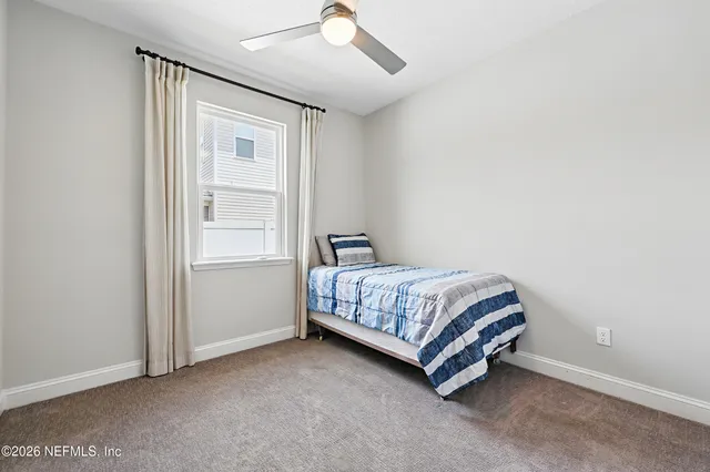 a room with a bed and window