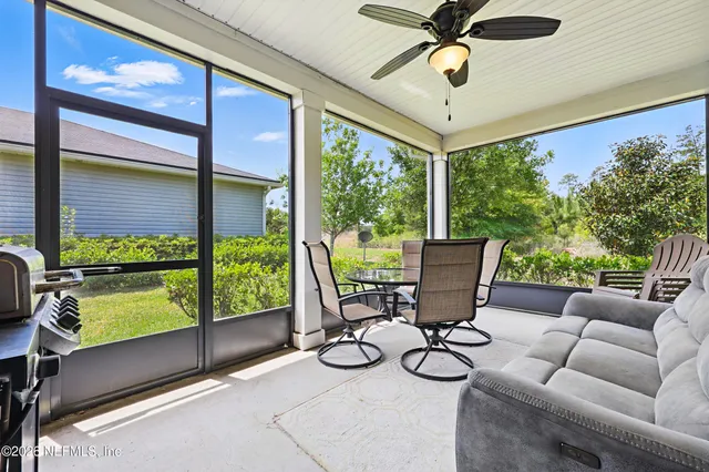 a view of a dining room with furniture wooden floor and chandelier