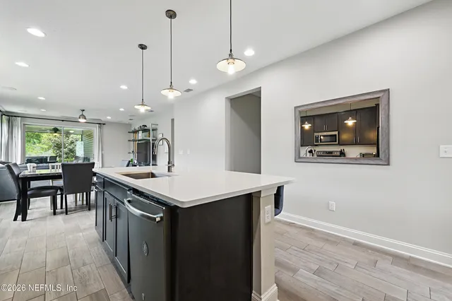 a kitchen with a table and chairs