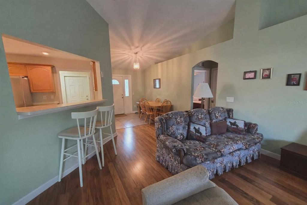 14396 Southwest 19th Place Ocala, FL 34481 - Photo 2 of 10 a living room with furniture and a wooden floor