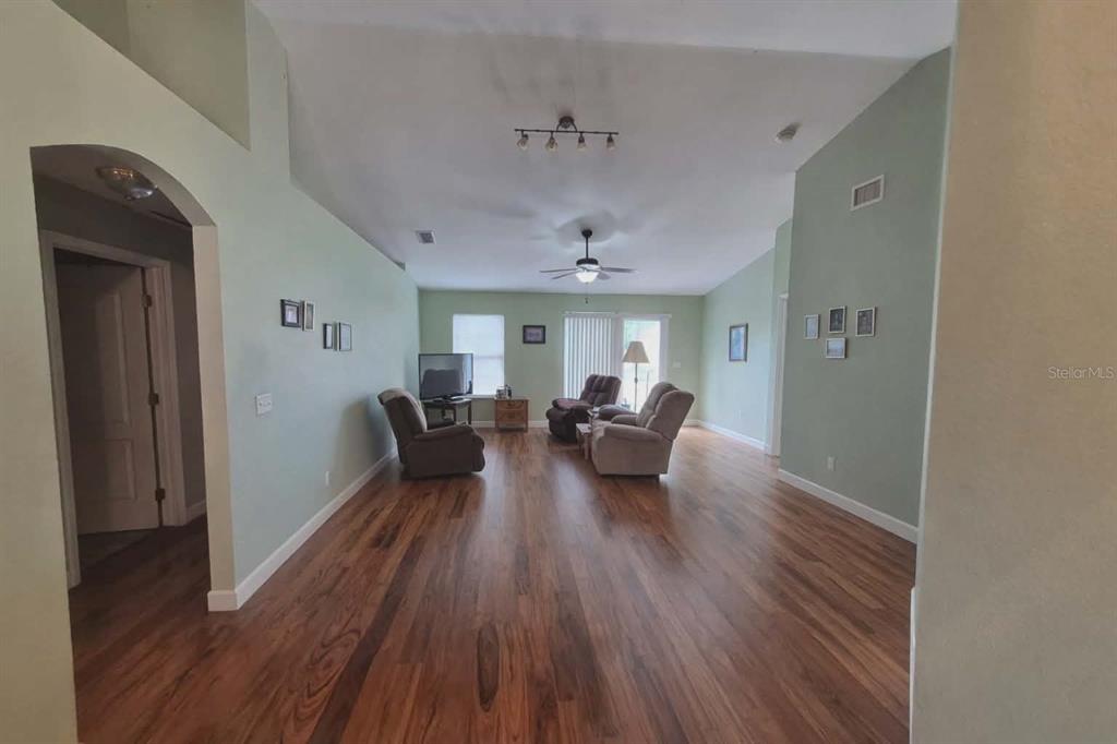 14396 Southwest 19th Place Ocala, FL 34481 - Photo 5 of 10 a living room with furniture and a wooden floor