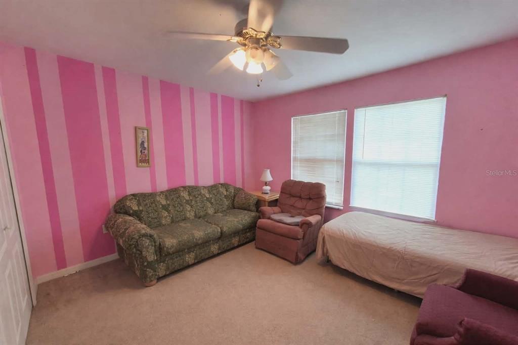 14396 Southwest 19th Place Ocala, FL 34481 - Photo 6 of 10 a living room with furniture and a large window