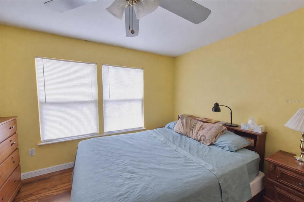 14396 Southwest 19th Place Ocala, FL 34481 - Photo 9 of 10 a bedroom with a bed and a window