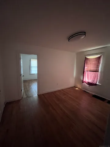 a view of empty room with windows