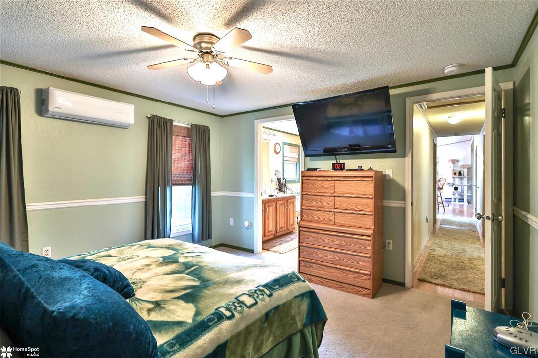 7197 Borman Road New Tripoli, PA 18066 - Photo 15 of 30 a bedroom with a bed and a television