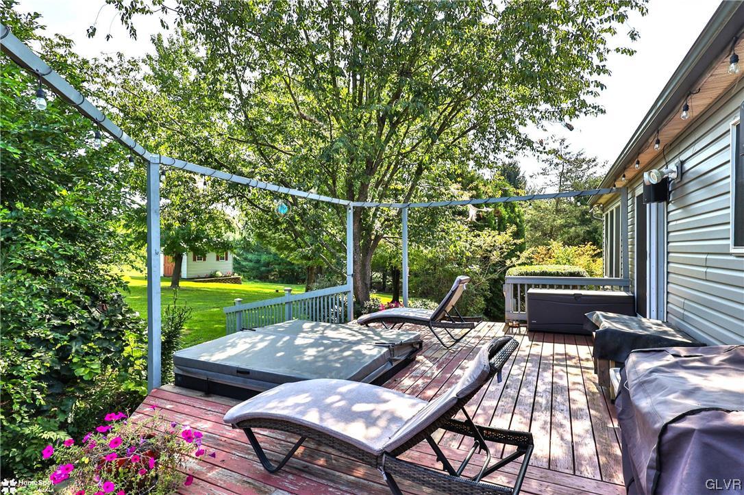 7197 Borman Road New Tripoli, PA 18066 - Photo 23 of 30 a view of a patio with couches table and chairs potted plants and garden