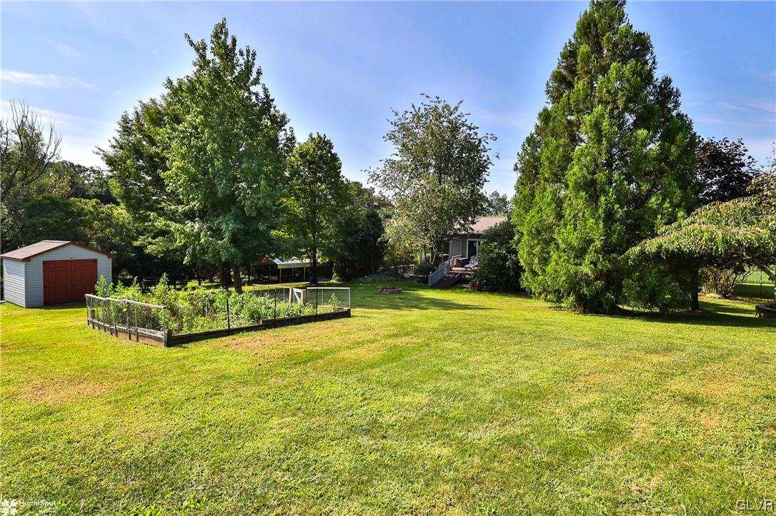7197 Borman Road New Tripoli, PA 18066 - Photo 25 of 30 a view of a swimming pool with an outdoor seating and a yard