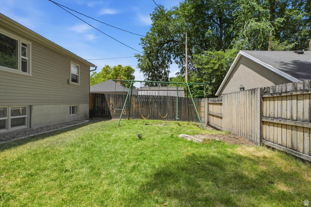 565 East 800 North Logan, UT 84321 - Photo 21 of 27 Expansive green lawn with a privacy fence