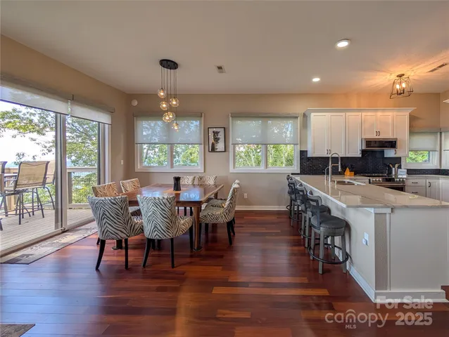 a view of a dining room with furniture window and outside view