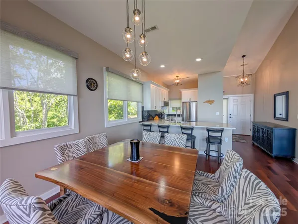 a view of a dining room with furniture window and outside view