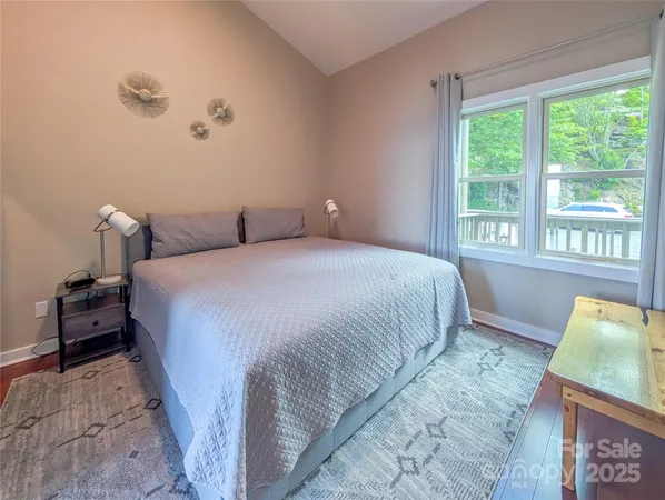 a bedroom with a bed and a couch