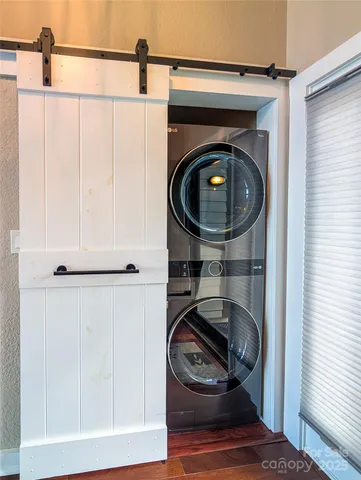 a close view of a utility room with dryer and washer
